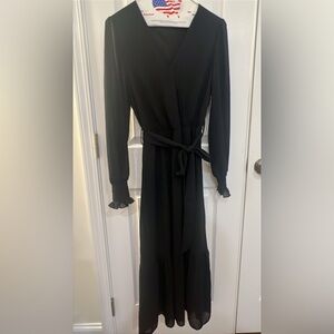 Black wide legged jumpsuit. Never worn. Size small. Tie belt at the waist